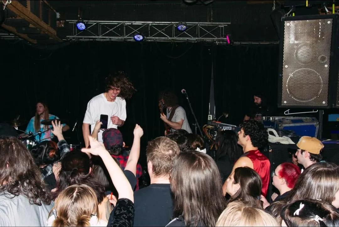 A band playing to a full room